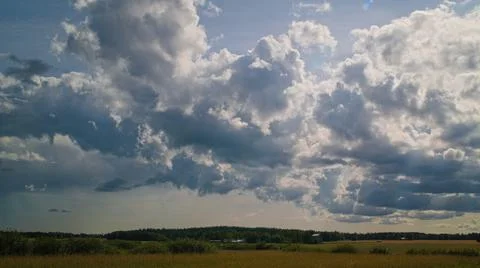 Clouds over the field Stock Photos