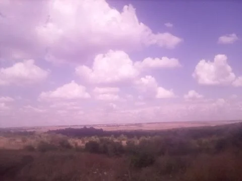 Clouds over the field Stock Photos