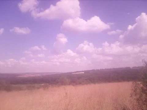 Clouds over the field Stock Photos