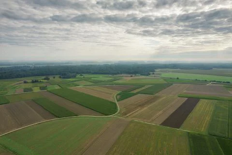 Clouds over flatland fields 스톡 사진