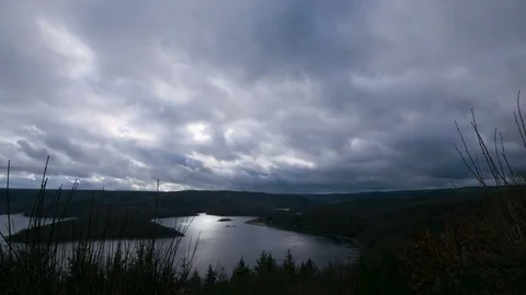 Clouds over forest and lake landscape timelapse Stock Footage 83826074