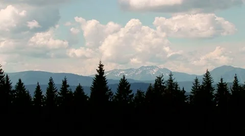 Clouds over the forest and mountains Stock Footage 69009052