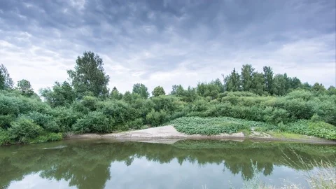 Clouds over the forest river Stock Footage 71990019