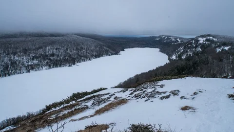 Clouds over frozen lake Stock Footage 100138254