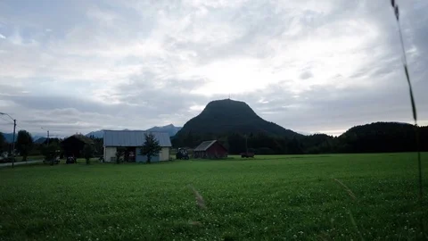 Clouds Over A Green Landscape and Mountains Stock Footage 83851361