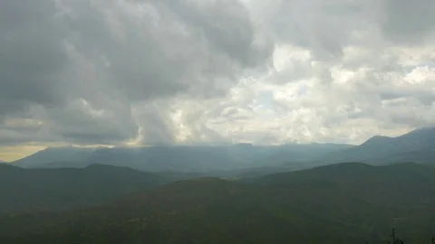 Clouds over green mountains Stock Footage 79443874