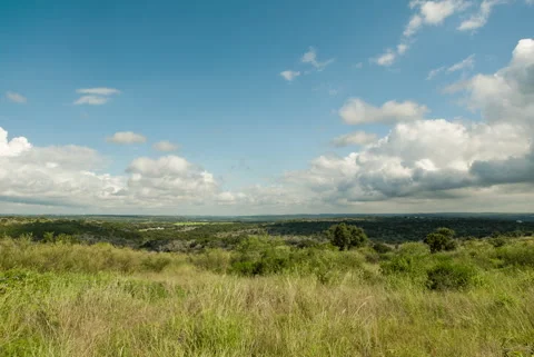 Clouds over green rolling hills timelapse in Texas Stock-Footage 348046536