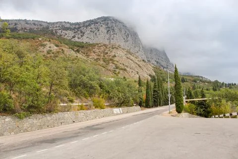 Clouds over high cliffs. 库存照片