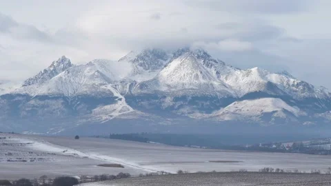 Clouds over High Tatras rocky mountains in winter season Video stock 135405409