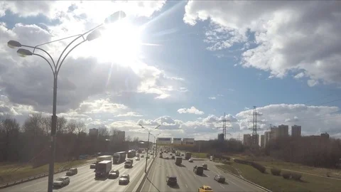 Clouds over highway in the spring day timelapse 動画素材 78019574