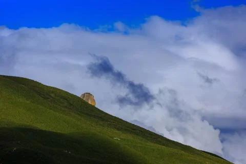 Clouds over the hills in the area of Mount Elbrus. Photographed in the Caucas Stock Photos
