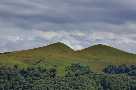 Clouds over the hills in the area of Mount Elbrus. Photographed in the Caucas Stock Photos