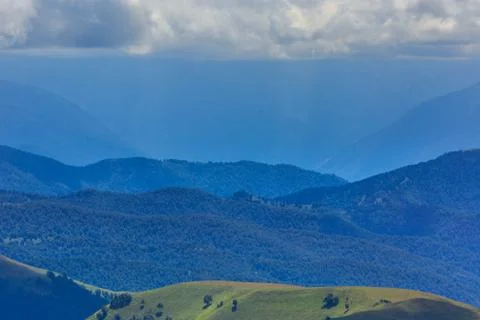 Clouds over the hills in the area of Mount Elbrus. Photographed in the Caucas Stock Photos