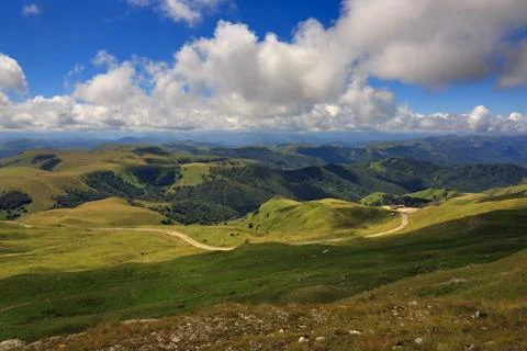 Clouds over the hills in the area of Mount Elbrus. Photographed in the Caucas Stock Photos