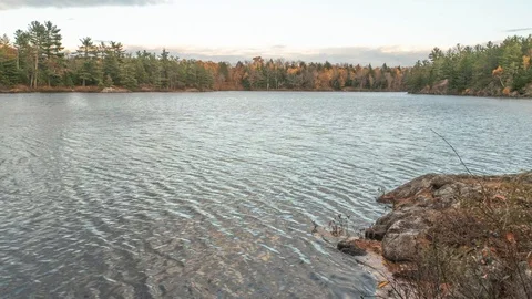 Clouds over lake in the fall Stock Footage 100138355