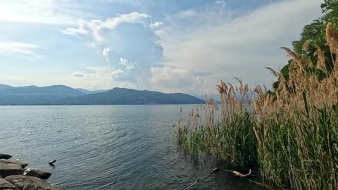 Clouds over lake in mountains Stock Footage 263852711