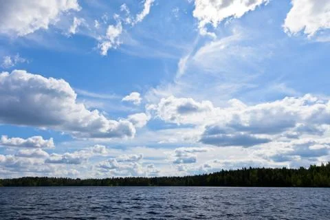 Clouds over a lake Stock Photos