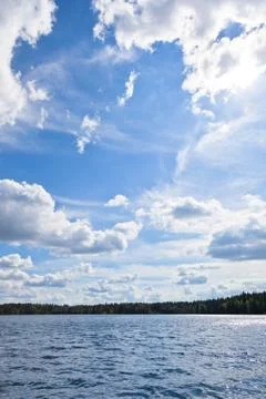 Clouds over a lake Stock Photos