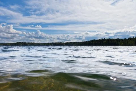 Clouds over a lake Stock Photos