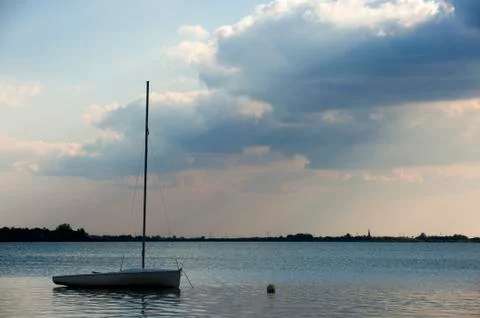 Clouds over the lake Stock Photos