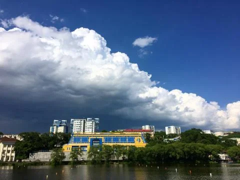 Clouds over the lake in summer Stock Photos
