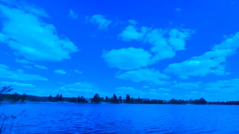 Clouds over the lake through the filter. Stock Footage 141127191