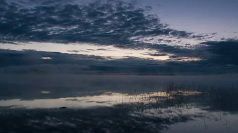 Clouds over the lake, timelapse Stock Footage 8519933