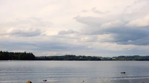 Clouds over a lake - Timelapse Video stock 78734611