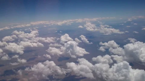 Clouds over landscape from an airplane Stock Footage 93781169