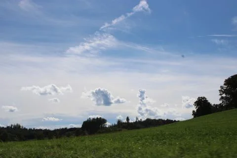 Clouds over a landscape. Stock Photos