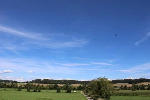 Clouds over a landscape Stock Photos