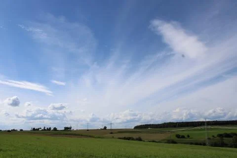 Clouds over a landscape Stock Photos