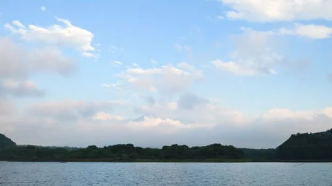 Clouds over Mount Fuji before sunset from lake Shoji, Yamanashi, Japan Stock Footage 315010559