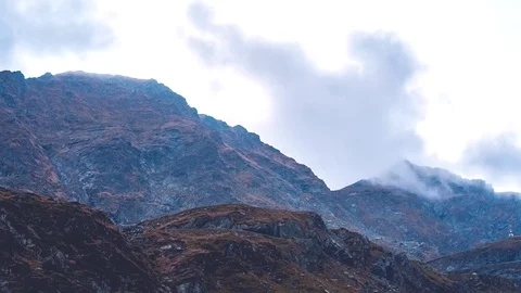 Clouds over mountain 4K timelapse Stock Footage 99429971