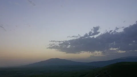 Clouds Over a Mountain at Dusk Stock Footage 53202961