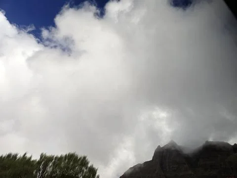Clouds over mountain landscape with blue sky 写真素材