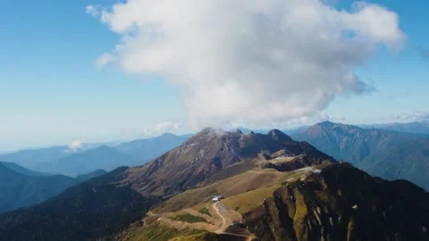 Clouds over a mountain peak, accelerated shooting. Stock Footage 273922679