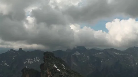 Clouds over mountain peaks Stock Footage 83697624