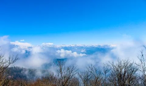 Clouds over the mountain Stock Photos