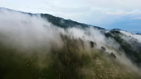 Clouds over the mountain range. Flyover over mountain clouds Stock Footage 165787363