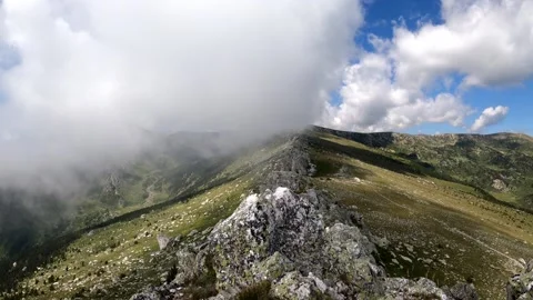Clouds over the mountain ridge Stock Footage 141363405