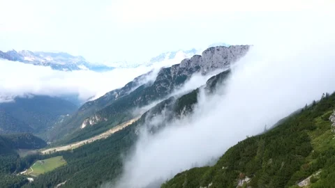 Clouds over mountain ridge Mangart, Slovenia - Drone video 動画素材 145879601