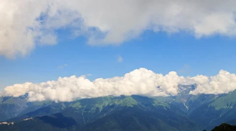 Clouds over the mountain ridge. Time Lapse. Krasnaya Polyana, Sochi, Russia. 4K Vídeo Stock 53607810