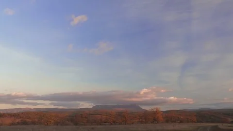 Clouds over mountain at sunset, time lapse Stock Footage 81207254