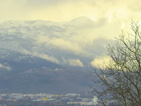 Clouds over the mountain with a tree in forhead Stock Footage 71942028