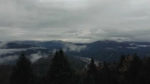 Clouds over a mountain valley 動画素材 167667317