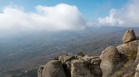 Clouds over a mountain valley horizontal move timelapse Video stock 68851056