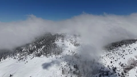 Clouds over the mountain in winter Stock Footage 320076918