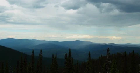 Clouds over the mountainous forests/time lapse Video stock 66798335