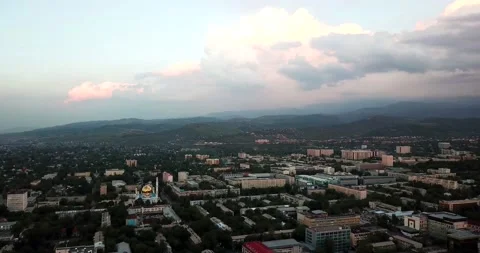 Clouds over mountains and city of Almaty at sunset 動画素材 143701454